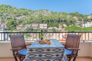 a table with a bowl of fruit on a balcony at Delta 3 in Sóller