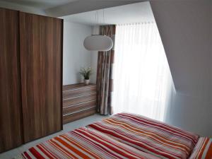Ein Bett oder Betten in einem Zimmer der Unterkunft Ferienwohnungen Parkstraße