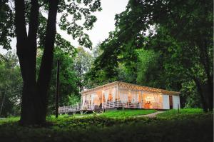 a house in the middle of a park with trees at Vozdvizhenskoe Park Hotel in Serpukhov