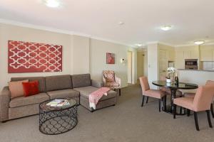 a living room filled with furniture and a couch at Marrakesh Apartments in Gold Coast