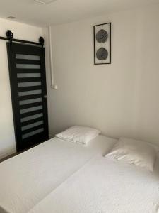 Postel nebo postele na pokoji v ubytování Hôtel le petit randonneur