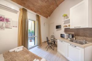 a kitchen with a sink and a counter top at B&B Prima Dell'Elba in Piombino