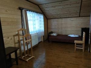 Tempat tidur dalam kamar di Оселя Драгобрат