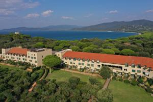 an aerial view of a building with a lake at Punta Ala Sea View Apartments in Punta Ala