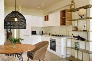 A cozinha ou cozinha compacta de Punta Ala Sea View Apartments