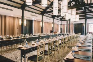a large banquet hall with tables and chairs at Seava Ho Tram Beach Resort in Ho Coc