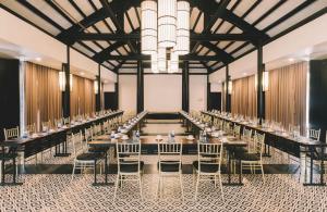 a large banquet hall with tables and chairs at Seava Ho Tram Beach Resort in Ho Coc
