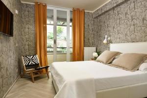 Cama ou camas em um quarto em Punta Ala Sea View Apartments