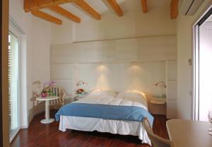 Rúm í herbergi á Park Hotel Il Vigneto