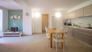a kitchen and dining room with a table and chairs at Casa Gardan in Levanto