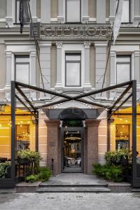 a store front of a building with a sign on it at CITYHOTEL in Kyiv