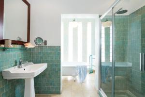 a bathroom with a sink and a shower at Hotel Punta Sur in Tarifa