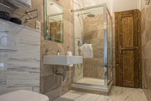 a bathroom with a sink and a shower at Mountain Resort Ždiar - River in Ždiar