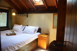Postel nebo postele na pokoji v ubytování DIMITRA's VILLAS