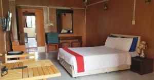 Katil atau katil-katil dalam bilik di โรงแรมวินบางนา Win Bangna Hotel