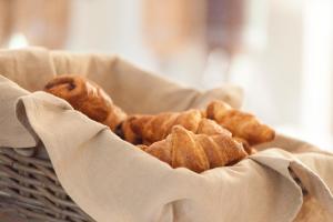 a basket full of donuts sitting on a table at Hotel Punta Sur in Tarifa