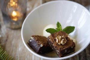 a white bowl with two pieces of brownies and mint at Hotel Punta Sur in Tarifa