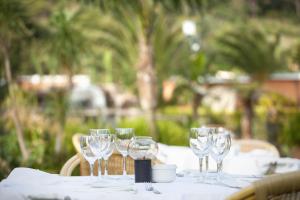 a table with wine glasses on top of it at Hotel Punta Sur in Tarifa