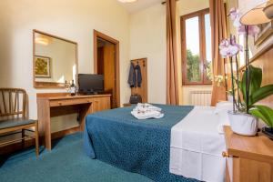 Postel nebo postele na pokoji v ubytování Hotel Trastevere