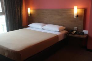 Posteľ alebo postele v izbe v ubytovaní Classique Hotel