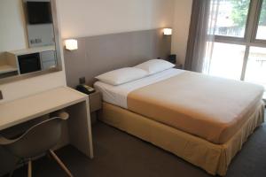 Posteľ alebo postele v izbe v ubytovaní Classique Hotel