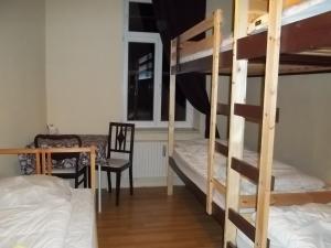 a bunk bed with two bunk beds in a room at Hostel No 5 in Halle an der Saale