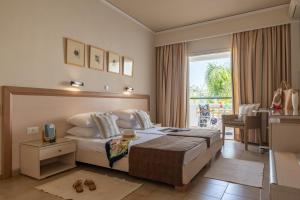Postel nebo postele na pokoji v ubytování Dedalos Hotel