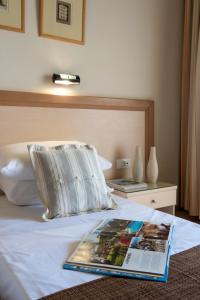 Postel nebo postele na pokoji v ubytování Dedalos Hotel