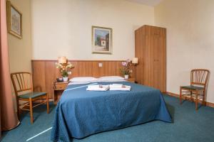 Postel nebo postele na pokoji v ubytování Hotel Trastevere