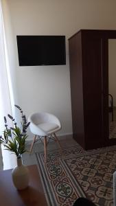 Televízia a/alebo spoločenská miestnosť v ubytovaní "RUNFULÌA" Deluxe apartment