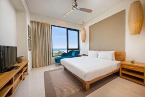 Postel nebo postele na pokoji v ubytování Abogo Apartment Resort Beach Da Nang