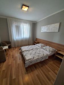 Postel nebo postele na pokoji v ubytování Penzion M.L.K