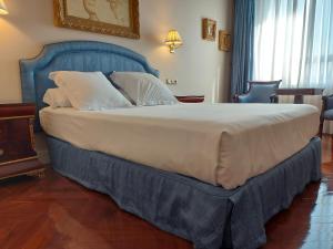 Cama ou camas em um quarto em Hotel Alameda Palace