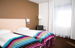 Ліжко або ліжка в номері Hotell Charlottenberg