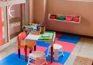a room with a table and some chairs and a table at Hotel Express Aeroporto in Porto Alegre +32 photos