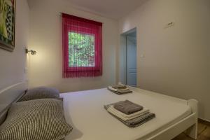 Posteľ alebo postele v izbe v ubytovaní Wonderful villa Nezakcij with pool near the town and the beach