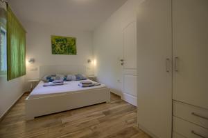 Posteľ alebo postele v izbe v ubytovaní Wonderful villa Nezakcij with pool near the town and the beach