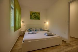 Posteľ alebo postele v izbe v ubytovaní Wonderful villa Nezakcij with pool near the town and the beach