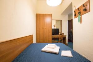Postel nebo postele na pokoji v ubytování Hotel Trastevere