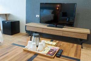 TV a/nebo společenská místnost v ubytování 河岸香榭&田苑民宿