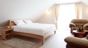 En eller flere senger på et rom på Hotel Novella Uno