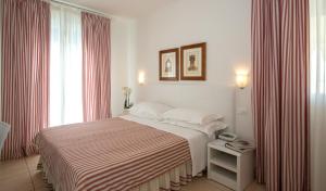 Postel nebo postele na pokoji v ubytování Hotel Plaza Esplanade