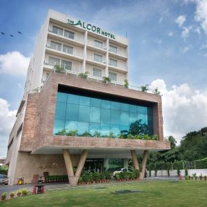 a building with a sign on top of it at The Alcor Hotel in Jamshedpur