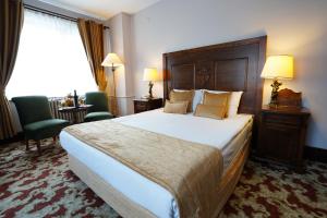 Giường trong phòng chung tại Le Chalet Yazici