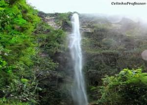 a waterfall in the middle of a forest at CASA - CIDADE das CACHOEIRAS in Santa Rita de Jacutinga