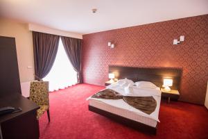 Postel nebo postele na pokoji v ubytování Hotel Meliss