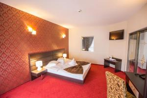Postel nebo postele na pokoji v ubytování Hotel Meliss