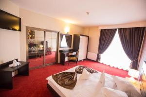 Postel nebo postele na pokoji v ubytování Hotel Meliss