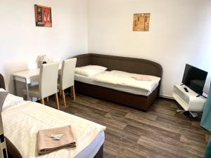 TV in/ali zabaviščno središče v nastanitvi Hotel Stará Pošta