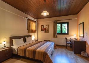 Postel nebo postele na pokoji v ubytování Hotel Oreades